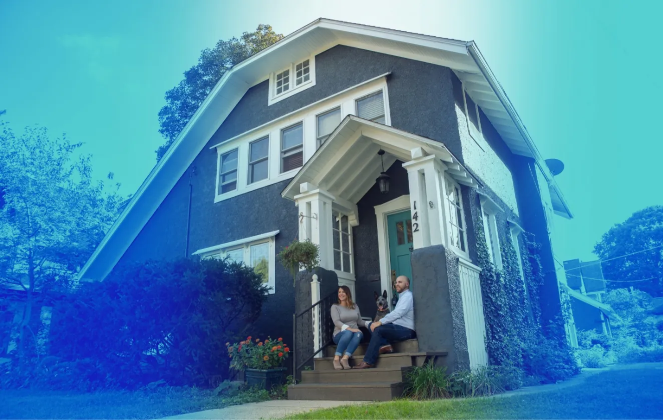 Family Sitting on the Outside Steps of a House